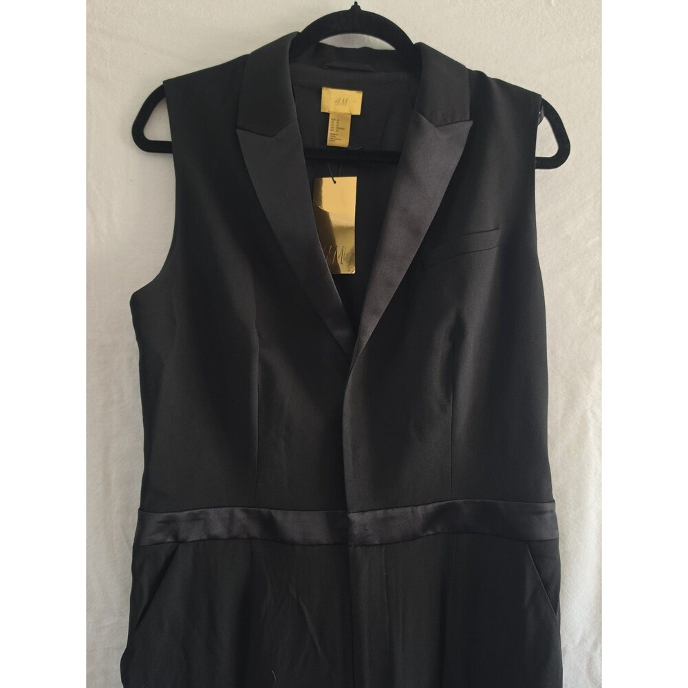 Black sleeveless jumpsuit featuring a tuxedo-style design size US 12